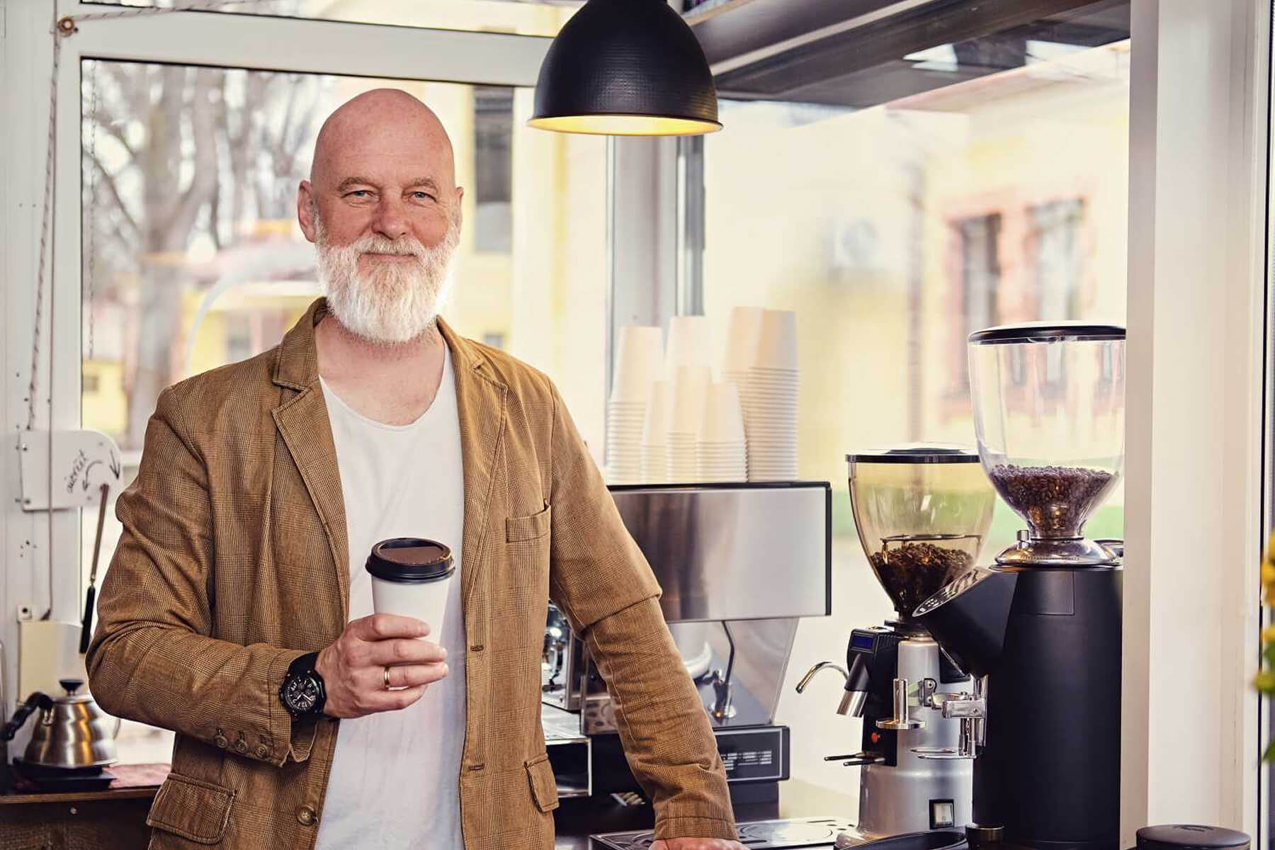 joyful-old-man-barista-dressed-in-casual-clothes-ZX2Z6F2.jpg